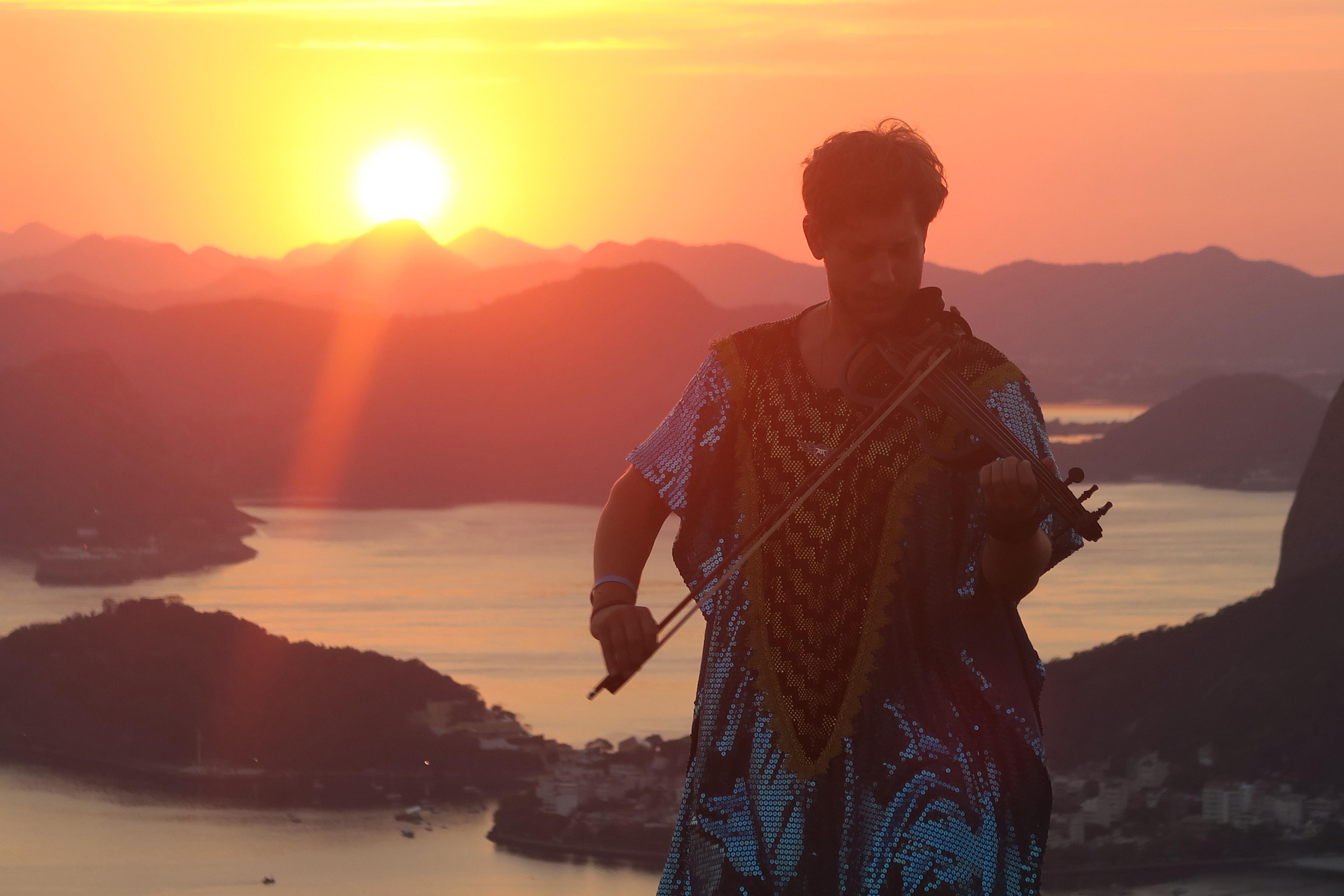 Seth Schwarz performing at sunset